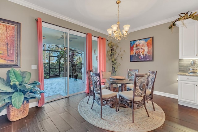 dining room with dark hardwood / wood-style flooring, crown molding, and ceiling fan with notable chandelier