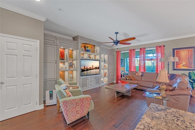 living room with crown molding, dark hardwood / wood-style floors, and ceiling fan