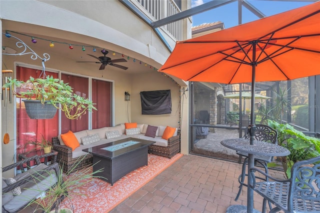 view of patio featuring an outdoor living space with a fire pit