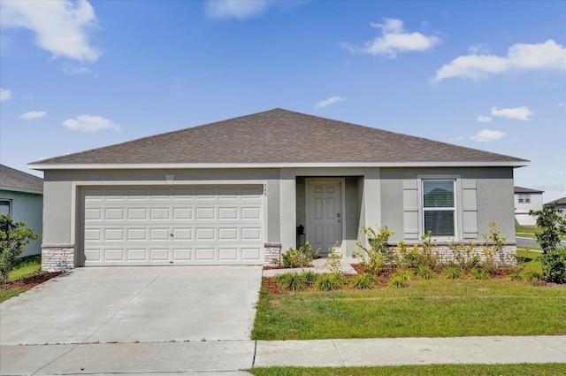 ranch-style home featuring driveway, a shingled roof, stone siding, a front lawn, and stucco siding