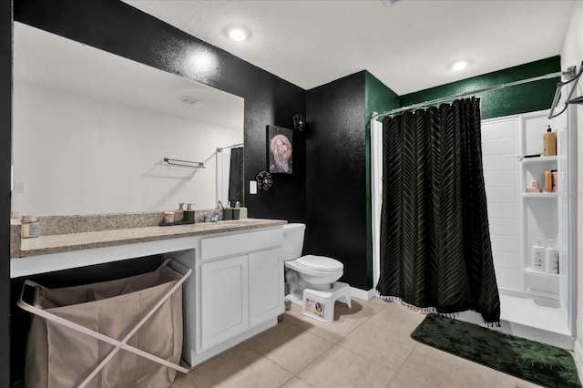 bathroom with toilet, a shower with shower curtain, visible vents, vanity, and tile patterned floors