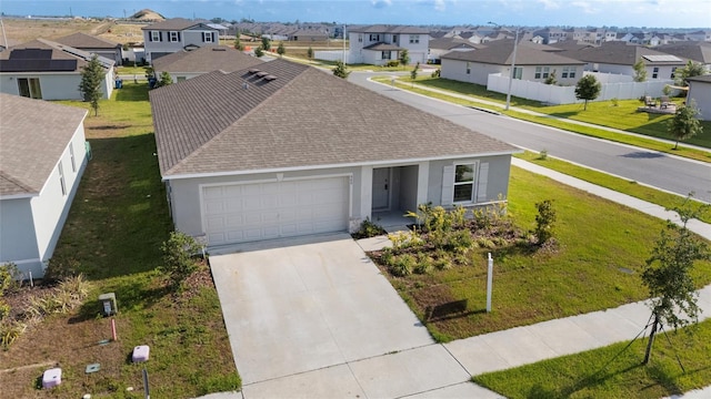 545 Jerry Ln, Haines City, FL 33844 - view of front of home featuring a residential view, stucco siding, roof with shingles, an attached garage, and concrete driveway