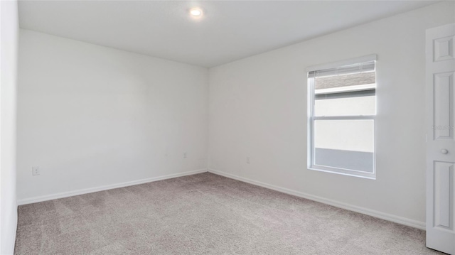 545 Jerry Ln, Haines City, FL 33844 - spare room featuring carpet flooring and baseboards