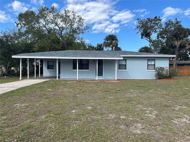 ranch-style house with a carport, a front yard, and covered porch