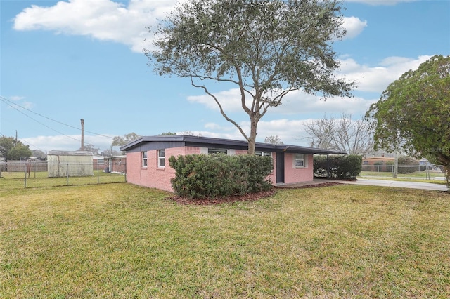 single story home featuring a carport and a front yard