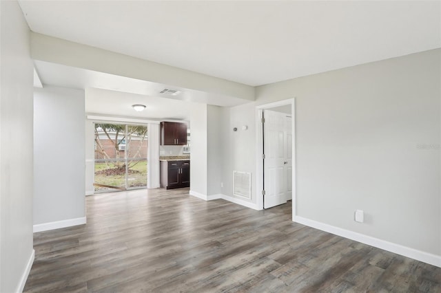 unfurnished living room with hardwood / wood-style floors