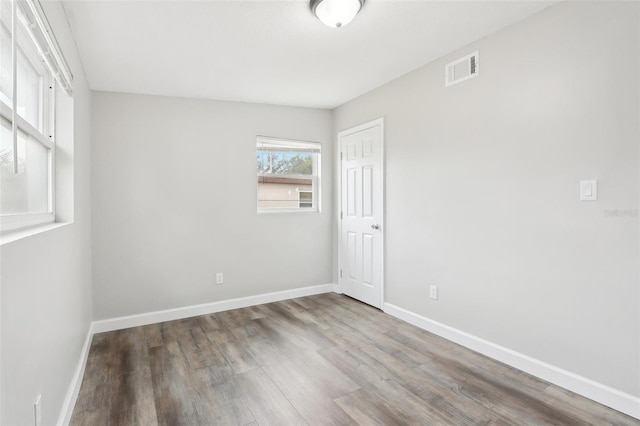 empty room featuring wood-type flooring