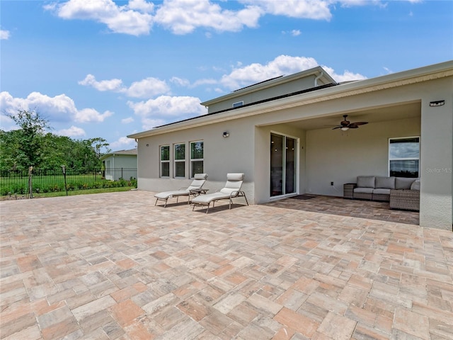 view of patio / terrace with an outdoor living space and ceiling fan