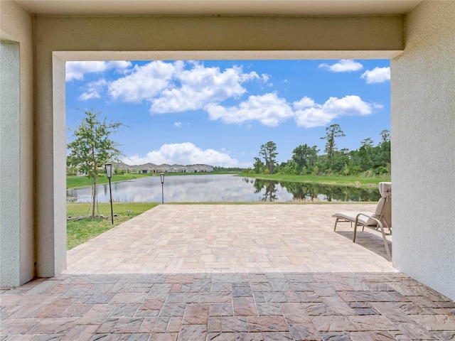 view of patio / terrace featuring a water view