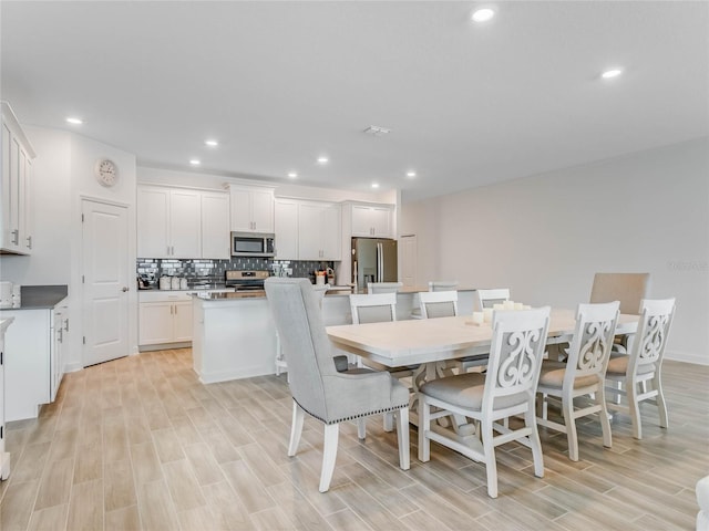 dining room with light hardwood / wood-style floors