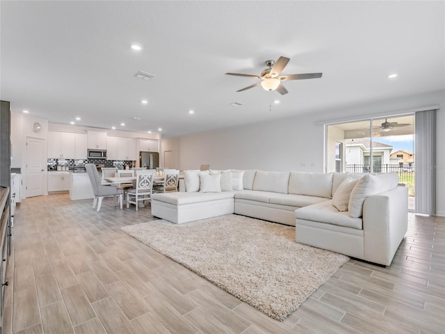 living room with ceiling fan