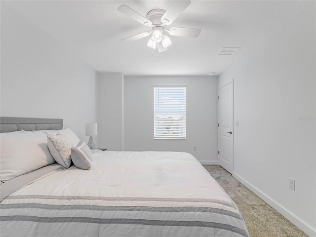 bedroom with light carpet and ceiling fan