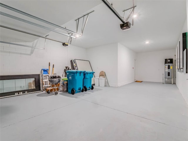 garage featuring a garage door opener and heat pump water heater