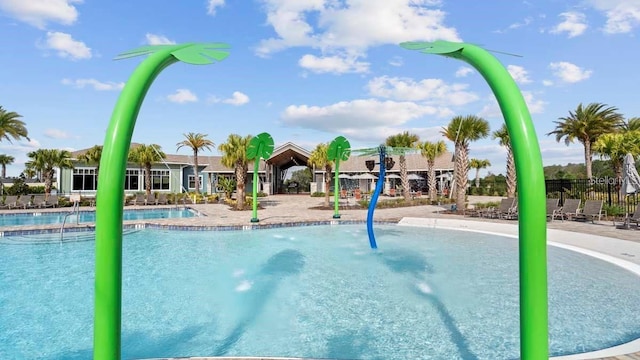 view of pool featuring pool water feature