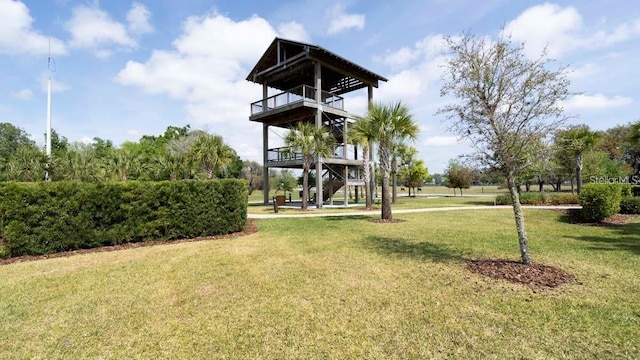 view of yard with a balcony