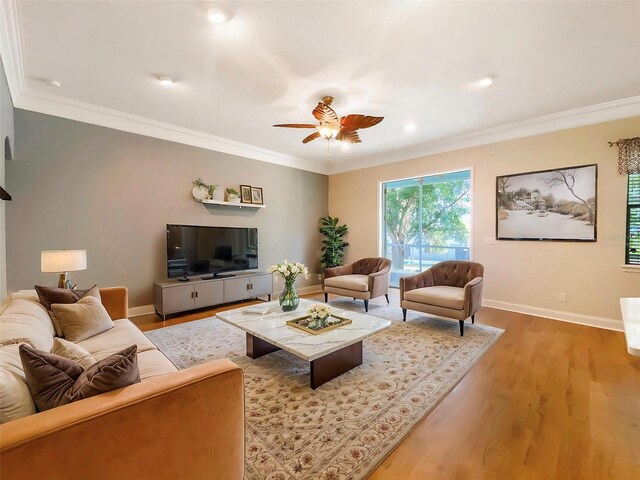 1224 Shorecrest Cir, Clermont, FL 34711 - living area featuring a ceiling fan, baseboards, wood finished floors, ornamental molding, and recessed lighting