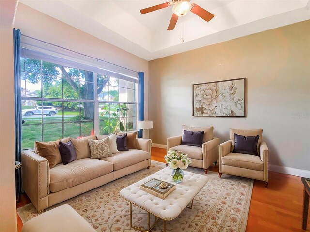 1224 Shorecrest Cir, Clermont, FL 34711 - living room featuring wood finished floors, baseboards, and ceiling fan