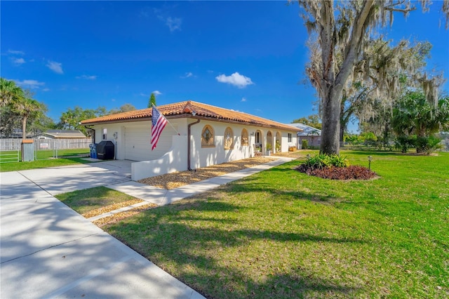 view of property exterior with a garage and a lawn