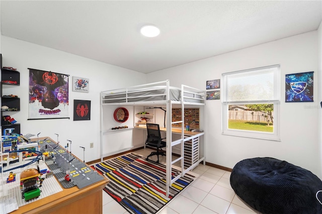 bedroom featuring light tile patterned flooring