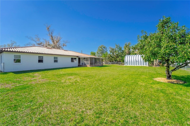 view of yard with a sunroom