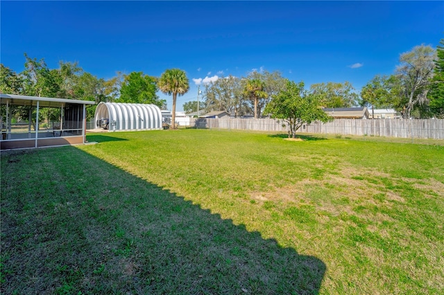 view of yard with a sunroom