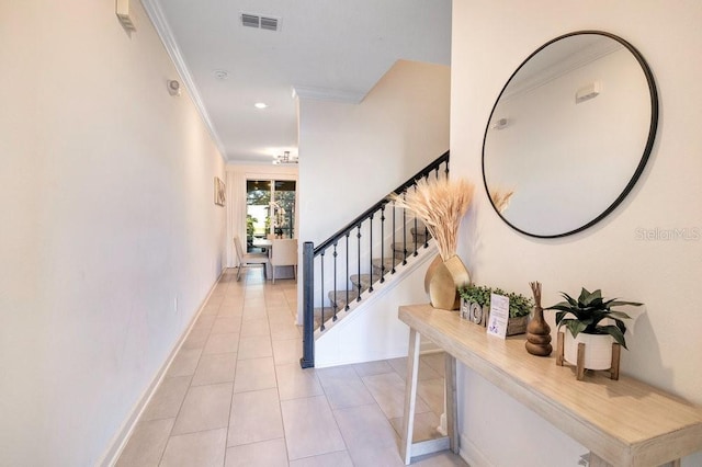 tiled entryway with ornamental molding