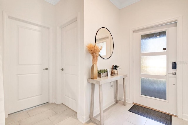 entrance foyer featuring light tile patterned floors