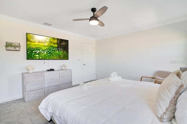 carpeted bedroom with crown molding and ceiling fan