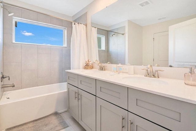 bathroom with vanity and shower / bath combo