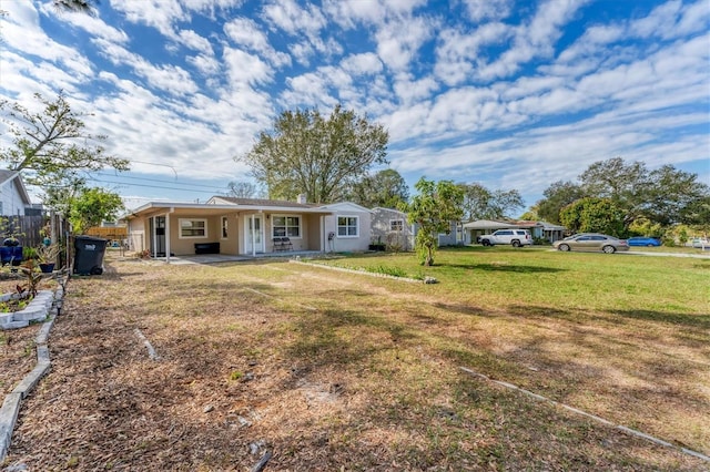 back of house with a yard