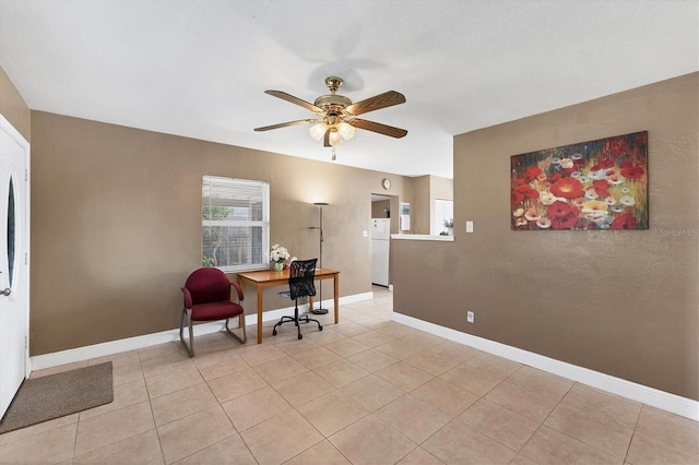 office featuring light tile patterned floors and ceiling fan