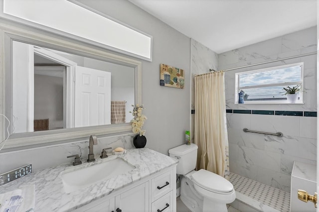 bathroom featuring vanity, toilet, and walk in shower