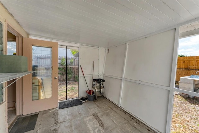 unfurnished sunroom featuring plenty of natural light