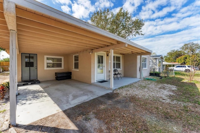 back of property with a patio area