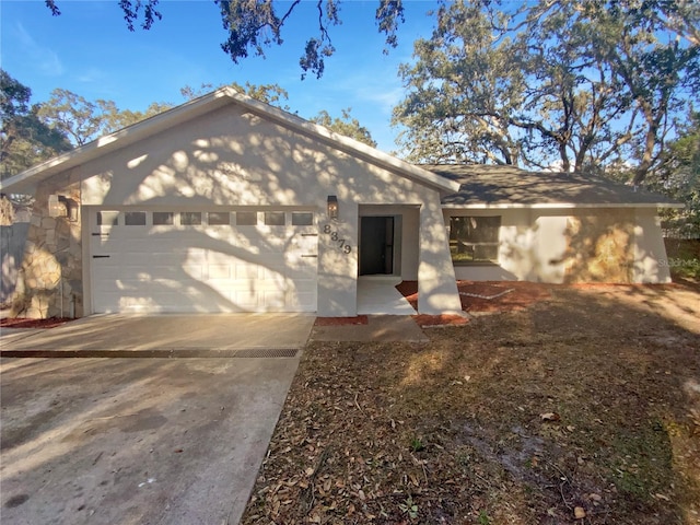 ranch-style house featuring a garage