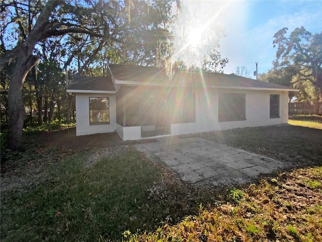 back of house with a yard and a patio area