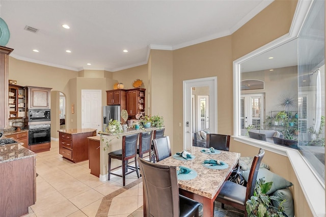 dining room featuring light tile patterned floors, recessed lighting, visible vents, and ornamental molding