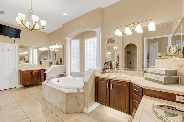 full bathroom featuring tile patterned floors, a sink, visible vents, and ornate columns