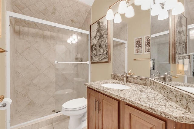 full bath with tile patterned flooring, a shower stall, toilet, and vanity