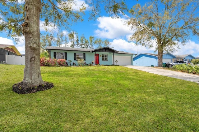 single story home with a garage, concrete driveway, a front lawn, and fence