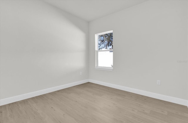 spare room with light wood-type flooring