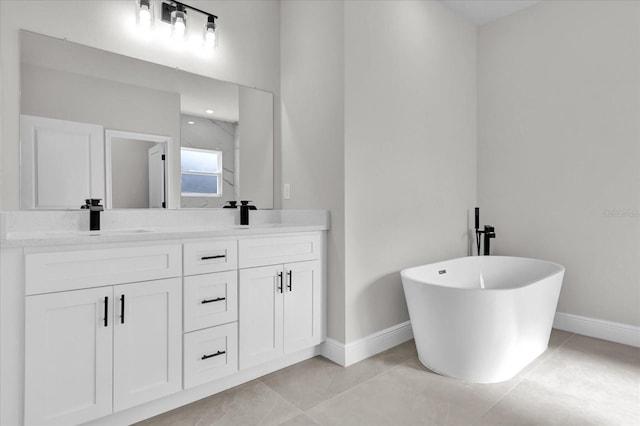 bathroom with vanity, tile patterned flooring, and a washtub