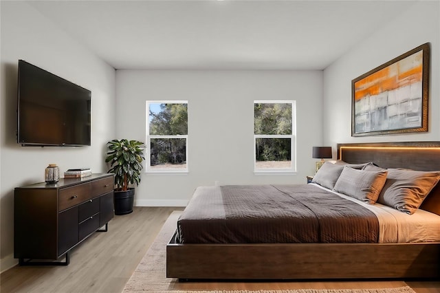 bedroom with light hardwood / wood-style floors