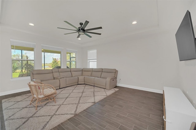 living room with hardwood / wood-style flooring and ceiling fan