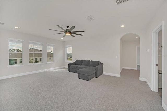 sitting room featuring ceiling fan and light carpet