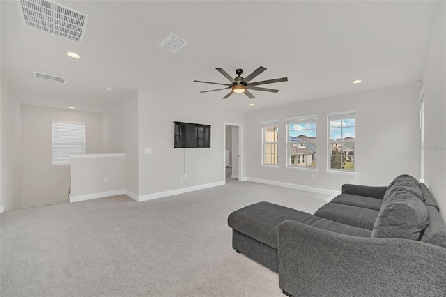 living room with light carpet and ceiling fan