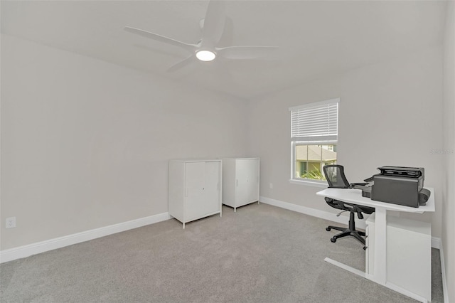 home office featuring light carpet and ceiling fan