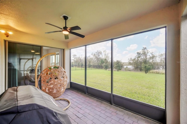 sunroom / solarium with ceiling fan