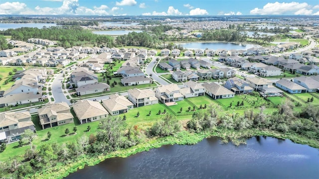 birds eye view of property featuring a water view