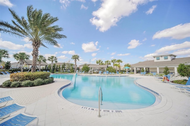 view of swimming pool with a patio area